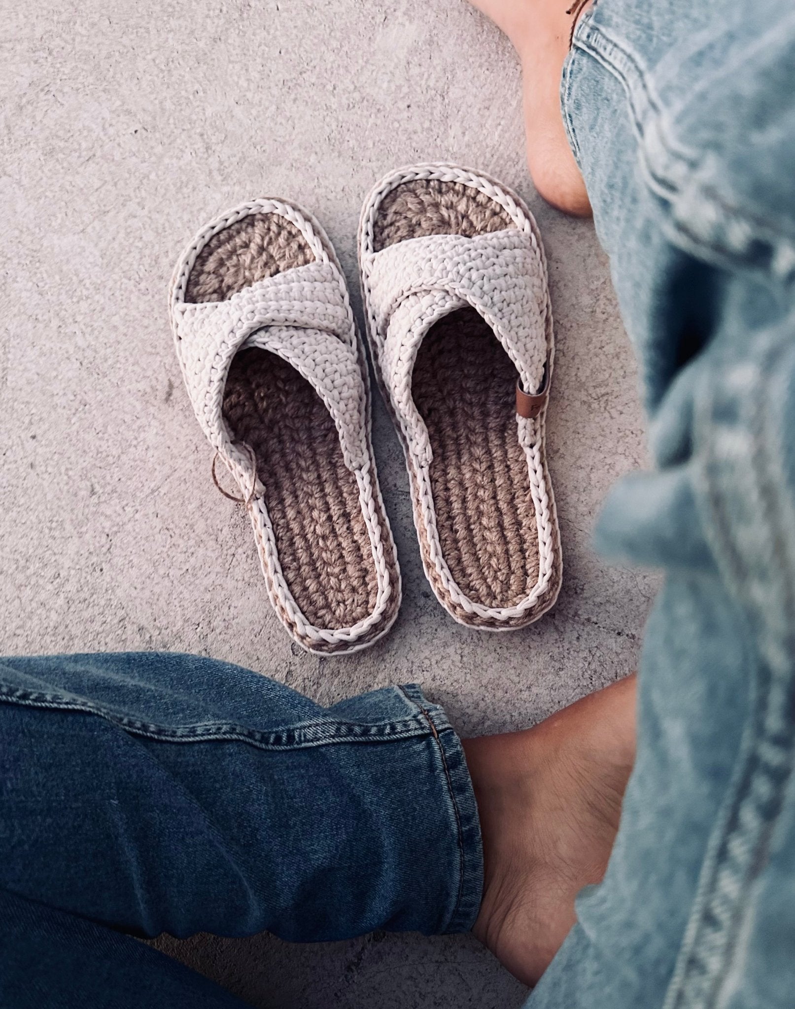 Handmade flats and womens legs wearing jeans