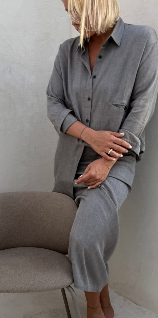 Women with a grey set near the chair